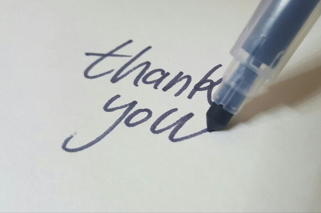 手書きの「Thank you」の文字の写真